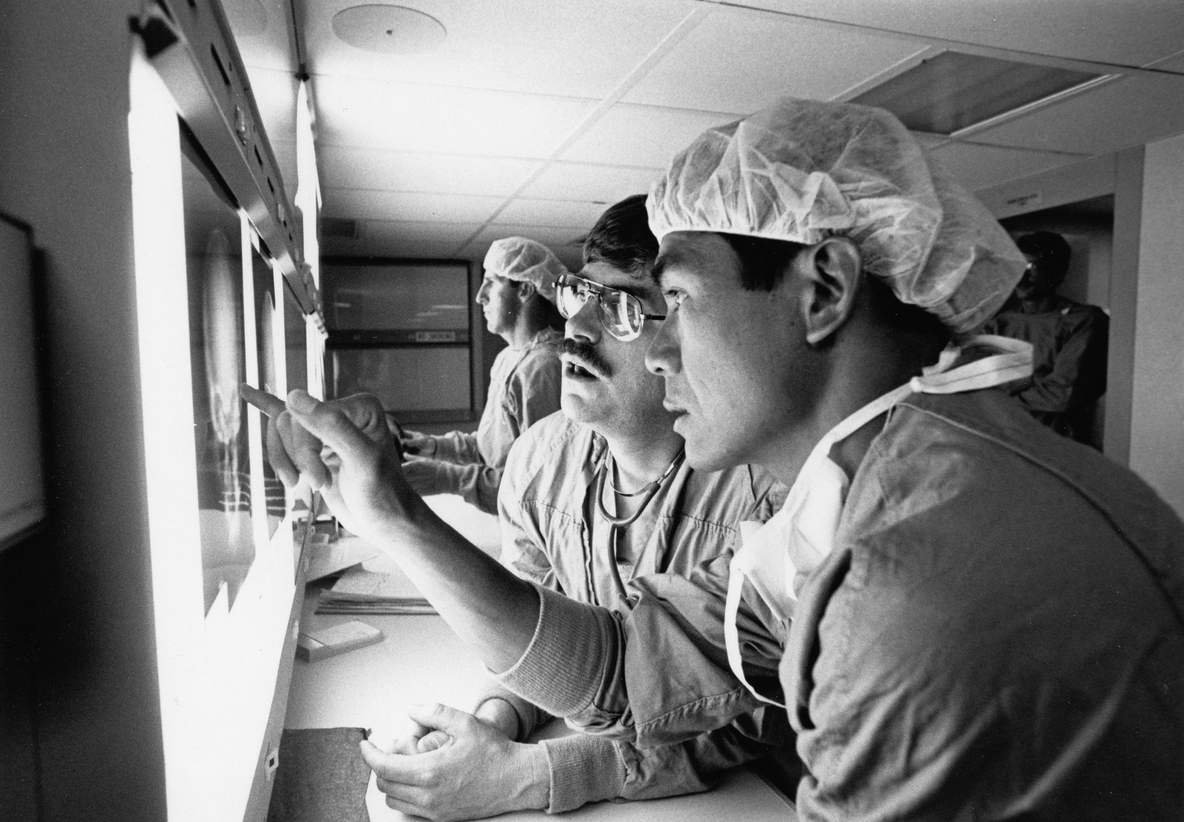GalaxyDiag scientists collaborating inside a molecular diagnostics lab.